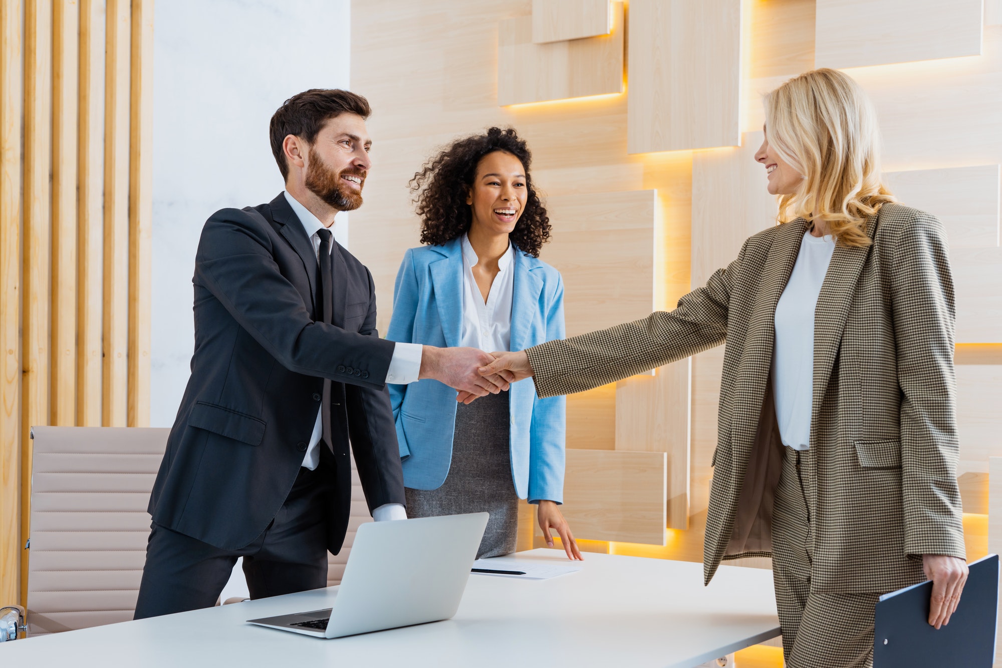 group-of-multiethnic-businesspeople-shaking-hands-for-a-business-deal.jpg